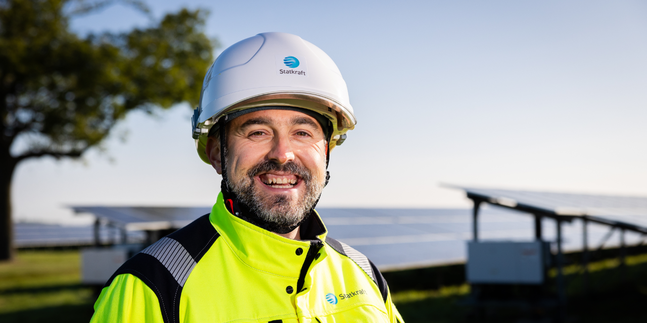 Man wearing safety gear smiling